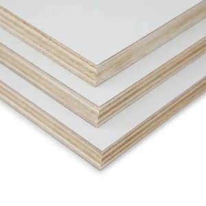 Close-up of three layered wooden picture frames with white matting at their beveled corners.