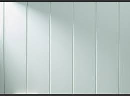 Light gray vertical metal panels forming a smooth wall surface, like industrial siding.