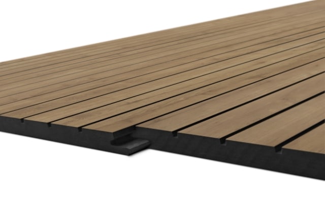 Section of a brown wooden deck plank platform showing where planks join and the black base underneath, angled together.