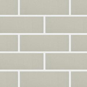 Beige rectangular subway tiles arranged in a brick pattern with white grout lines.