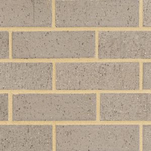 Brown brick wall with light tan mortar in a repeating rectangular pattern.