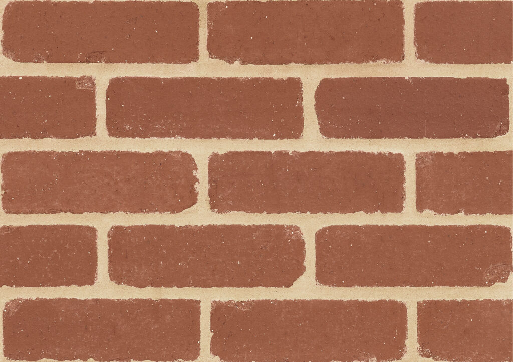 Red brick wall with light tan mortar in a running bond pattern, close-up texture.