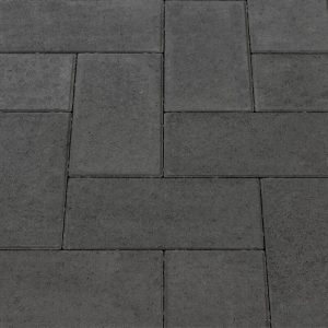 Gray interlocking concrete pavers arranged in a geometric pattern on a paved surface.