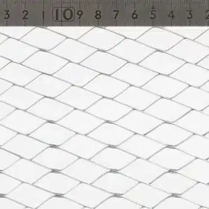 Close-up of white diamond-patterned mesh with rulers along the top and right edges for scale.