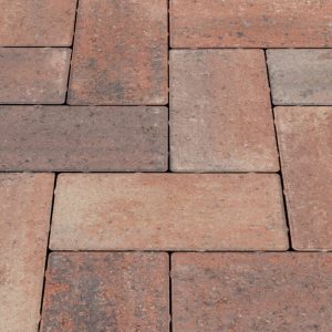 Brick paver walkway with rectangular reddish-brown stones in a grid pattern.